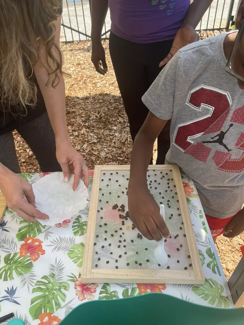 A hands-on garden activity for children at a MetM session