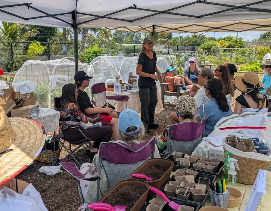 Melanie leading a hands-on gardening workshop for a seated group